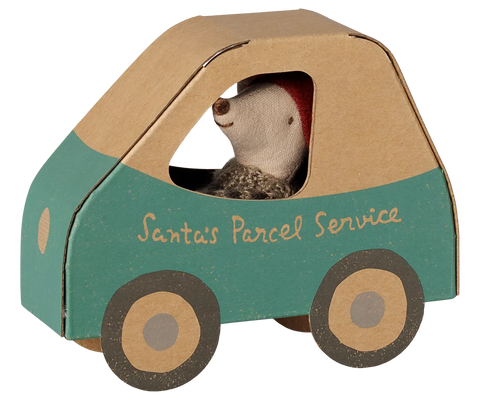 Christmas mouse toy peeking through the window of a cardboard car box