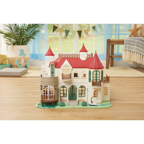 Red Roof Riverside Manor dollhouse miniature with red roofs and green window panels