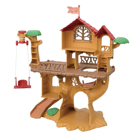 Wooden treehouse playset with red roof, platforms and attached swing on stand